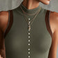 Ribbed Knit Sleeveless Vest With Pearl Button Detailing