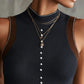 Ribbed Knit Sleeveless Vest With Pearl Button Detailing